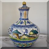 P17. Pottery bottle. Lid is chipped. 12” - $38 